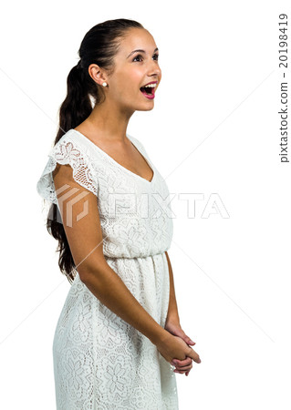 Surprised woman with open mouth looking up 20198419