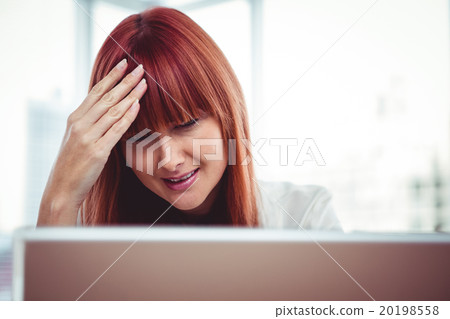 Hipster businesswoman having a headache Hipster businesswoman having a headache 20198558