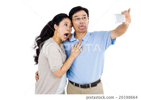 Man and woman taking a picture 20198664