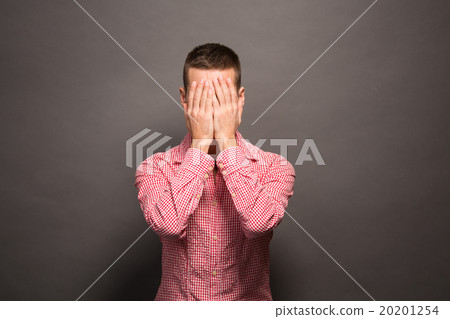 Man covering eyes his face Man covering eyes his face 20201254