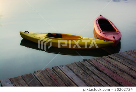 Yellow and Red Kayak on the lake 20202724