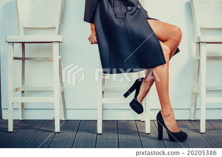 Woman with black high heels Woman with black high heels 20205386