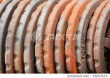 Steel rusted hand wheels in warehouse 20207614