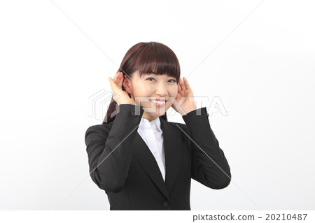 A woman holding her ear 20210487