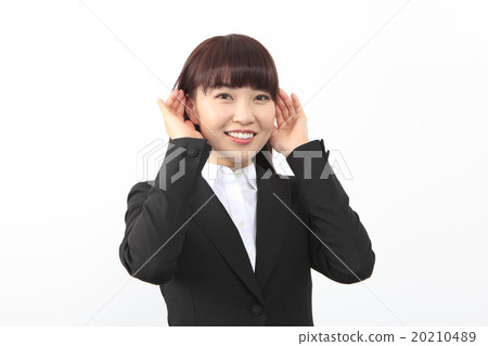 A woman holding her ear 20210489
