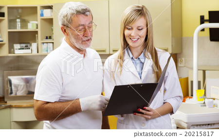 Dentist and assistant Dentist and assistant 20215817