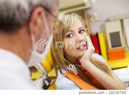 Patient is having a dental treatment Patient is having a dental treatment 20216748