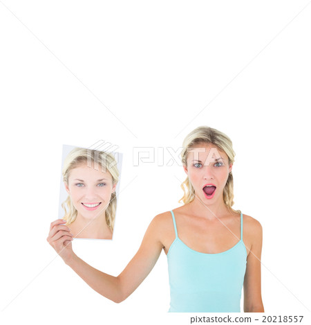 Woman showing picture of herself Woman showing picture of herself 20218557