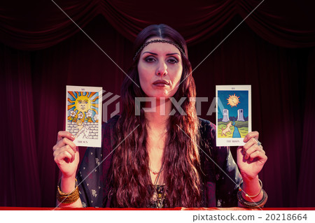 Composite image of portrait of serious fortune teller woman Composite image of portrait of serious fortune teller woman 20218664