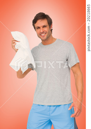 Composite image of portrait of a fit young man with towel 20218665