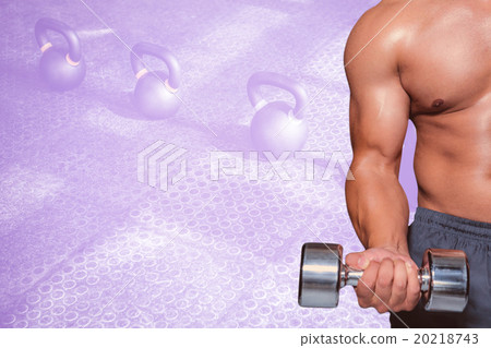 Composite image of mid section of a bodybuilder with dumbbell Composite image of mid section of a bodybuilder with dumbbell 20218743