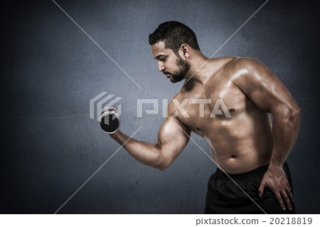 Composite image of muscular man lifting heavy dumbbell Composite image of muscular man lifting heavy dumbbell 20218819