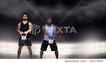 Composite image of strong friends lifting kettlebells together 20219003