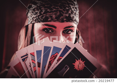 Composite image of fortune teller using tarot cards Composite image of fortune teller using tarot cards 20219477