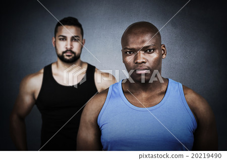 Composite image of strong friends looking at camera 20219490