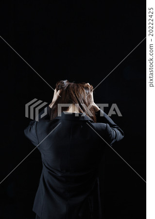 Despairing business woman behind you holding your head Despairing business woman behind you holding your head 20222425