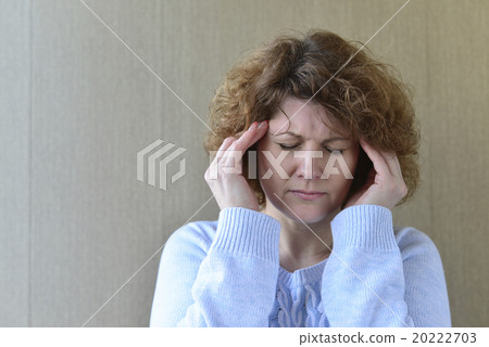 Woman holding hands on head, depression, pain Woman holding hands on head, depression, pain 20222703