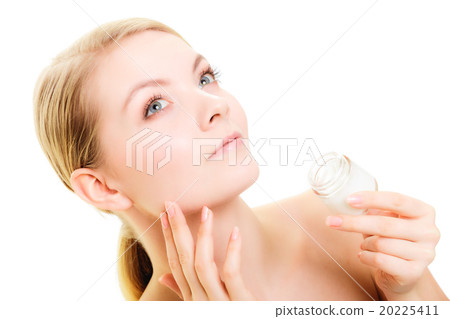Skin care. Girl applying moisturizing cream Skin care. Girl applying moisturizing cream 20225411