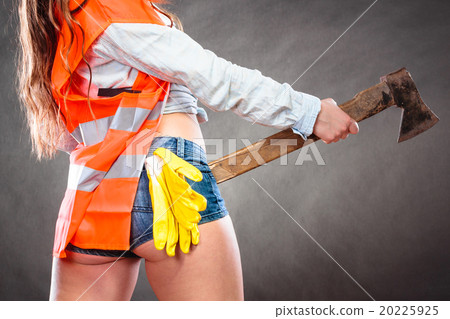 Closeup of woman feminist with axe at work. Closeup of woman feminist with axe at work. 20225925