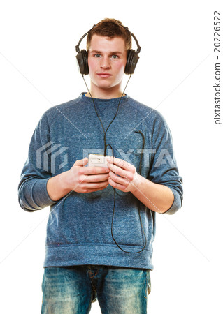 Young man with headphones listening music Young man with headphones listening music 20226522