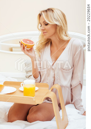 young beauty blond woman having breakfast in bed young beauty blond woman having breakfast in bed 20229684