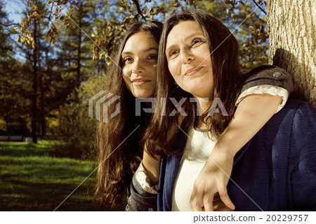 mature real mother with daughter outside autumn 20229757