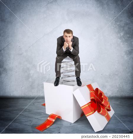 Businessman sitting on coil spring Businessman sitting on coil spring 20230445
