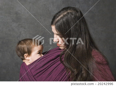 Mother with her daughter in sling Mother with her daughter in sling 20242996
