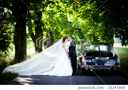 Bride and groom in car Bride and groom in car 20245868