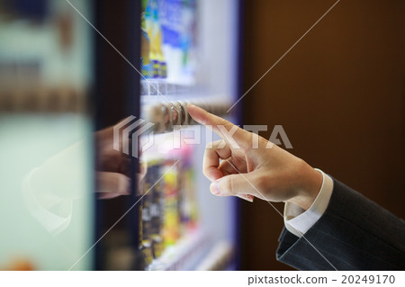 Businessman buying juice with vending machine 20249170
