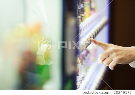 Businessman buying juice with vending machine 20249172