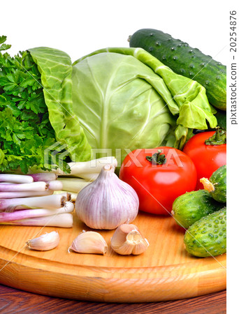 vegetables on cutting board isolated on white vegetables on cutting board isolated on white 20254876