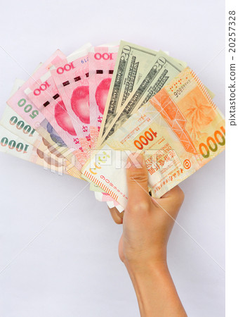 Hand with international cash Hand with international cash 20257328