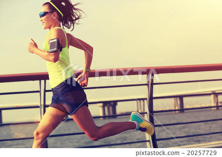 young fitness woman runner running at seaside 20257729