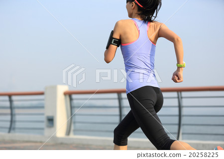 young woman runner athlete running at seaside young woman runner athlete running at seaside 20258225