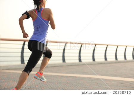 young woman runner athlete running at seaside 20258710