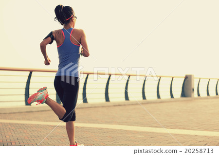 young woman runner athlete running at seaside 20258713