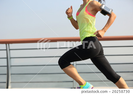 young fitness woman runner running at seaside young fitness woman runner running at seaside 20258730
