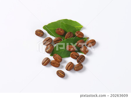 Roasted coffee beans with green leaves 20263609