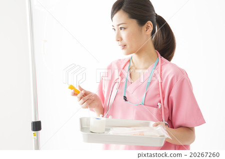 Medical image Young female doctor checking drip infusion 20267260