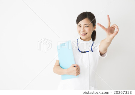 Medical image Young woman nurse in white dress 20267338