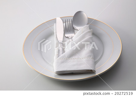folded napkin with utensils on plate 20272519