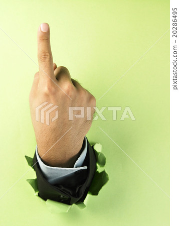 hand breaking through paper 20286495