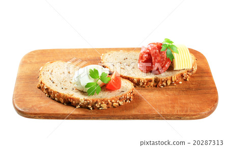 Bread with cheese spread and salami Bread with cheese spread and salami 20287313