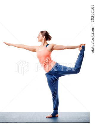 Woman doing yoga asana Natarajasana 20292163