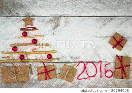 Christmas tree made of cardboard gift on wood  20294998