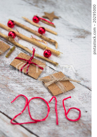 Christmas tree made of cardboard gift on wood  20295000