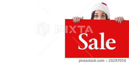 Composite image of festive brunette showing white poster Composite image of festive brunette showing white poster 20297058