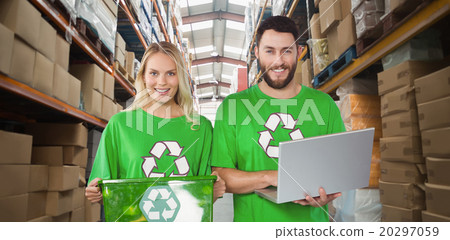 Composite image of portrait of smiling volunteers in recycling s Composite image of portrait of smiling volunteers in recycling s 20297059