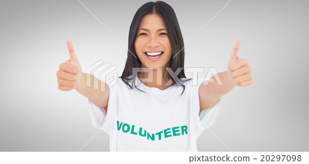 Composite image of woman wearing volunteer tshirt giving thumbs 20297098